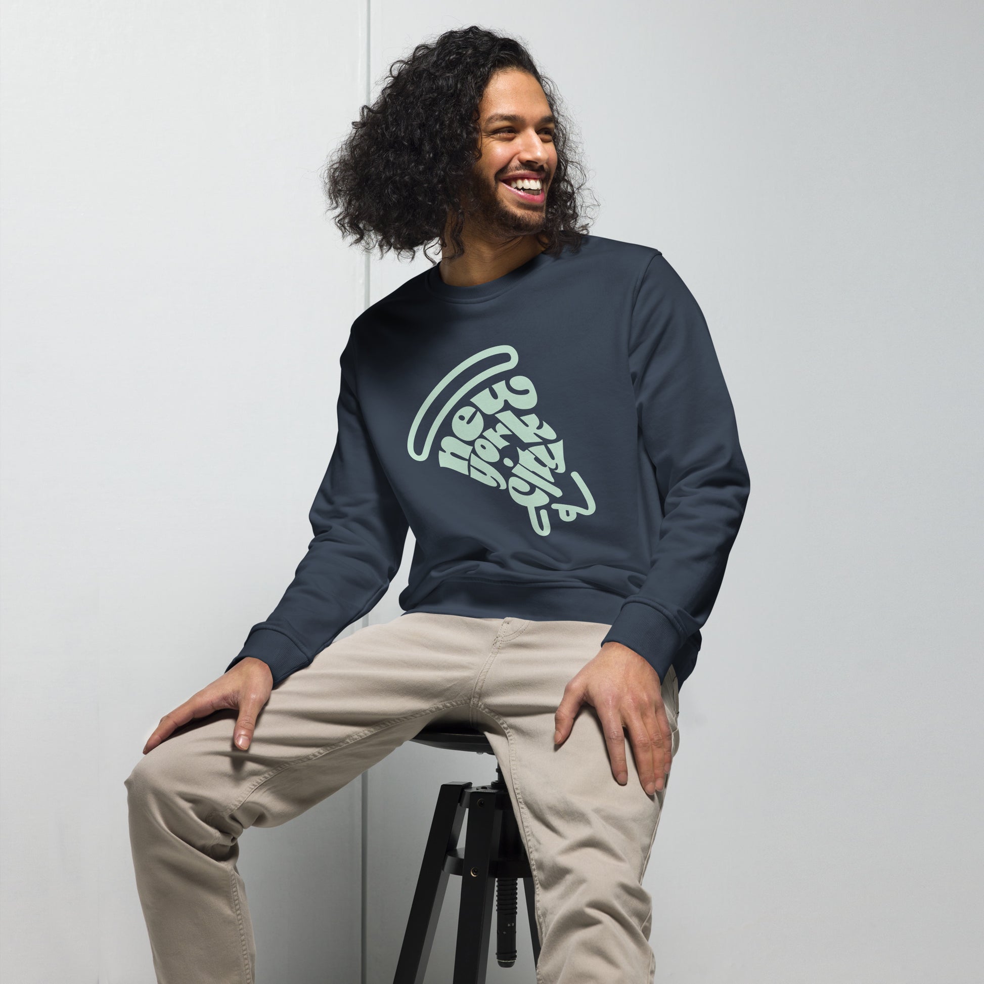 New York City Pizza Slice Unisex Crewneck Sweatshirt French Navy Adult Man sitting. City Crawl Adventures.